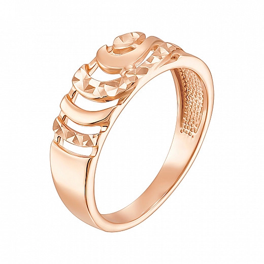 Auksinis žiedas raudoname fone su fasetu