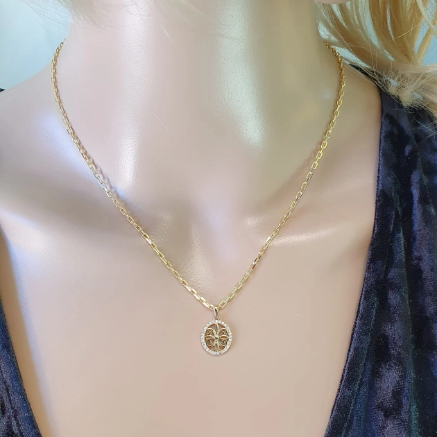 Moteriškas geltono aukso pakabukas su cirkoniais 585