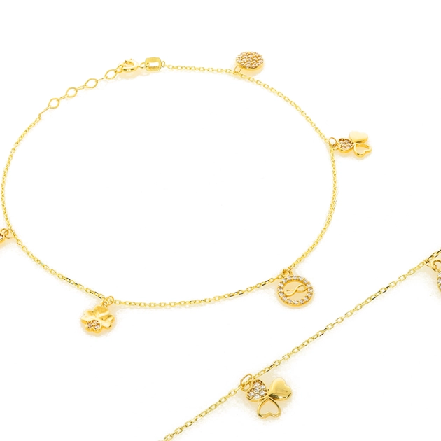 Moteriška geltono aukso apyrankė ant kojos su cirkoniais 585